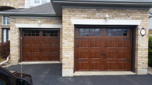 Walnut oak Clopay Gallery short panel door with square grille window inserts