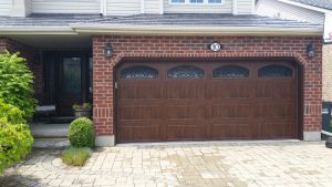 Walnut oak Clopay Gallery long panel door with wrought iron arch windows, variant 1