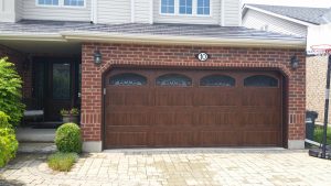 Walnut oak Clopay Gallery long panel door with wrought iron arch windows, variant 2