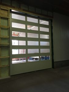 Clopay commercial insulated overhead door model 3728 with window panels