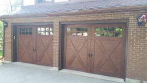 Walnut oak Clopay Canyon Ridge design 21 garage door with window inserts
