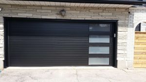Black Clopay Modern Steel door with modern grooved panel and frosted long window inserts