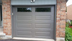 Bronze Clopay Classic door with elegant long panel and plain long window insert