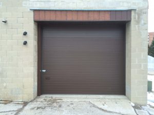 Overhead garage door installed at city parks and recreation facility by WM Haws