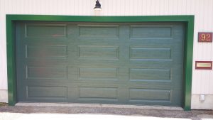 Green Clopay Classic Collection door with elegant long panel design, WM Haws Guelph
