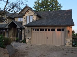 Sandtone Clopay Coachman carriage-house door variant 3, available in Guelph area