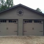 Sandtone Clopay Gallery door with elegant long panel and arch-1 rectangular grille