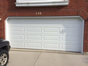 White Clopay Classic Collection door with elegant long panel design