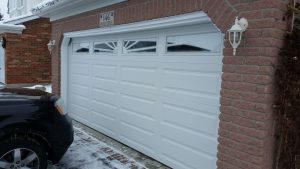 White Clopay Classic door, elegant long panel with Sunset 605 window, available in Guelph