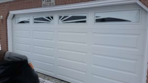 White Clopay Classic long panel garage door with Sunset 605 window insert