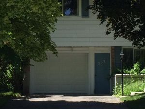 White Clopay Classic garage door with elegant short panel, available through WM Haws Guelph