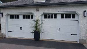 White Clopay Gallery long panel door with rectangular grille and standard hardware