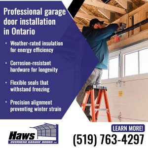 A garage door technician standing on a ladder and adjusting the hardware, motor, and torsion spring assembly of a newly installed white garage door inside a garage with exposed wooden rafters.