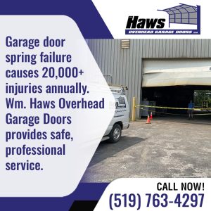 Commercial garage door with caution tape and service van during professional spring repair