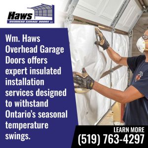 Technician installing insulation panels inside a garage door for improved energy efficiency